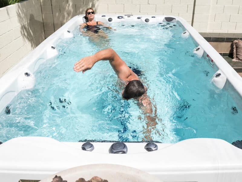 swim spa with man swimming in it